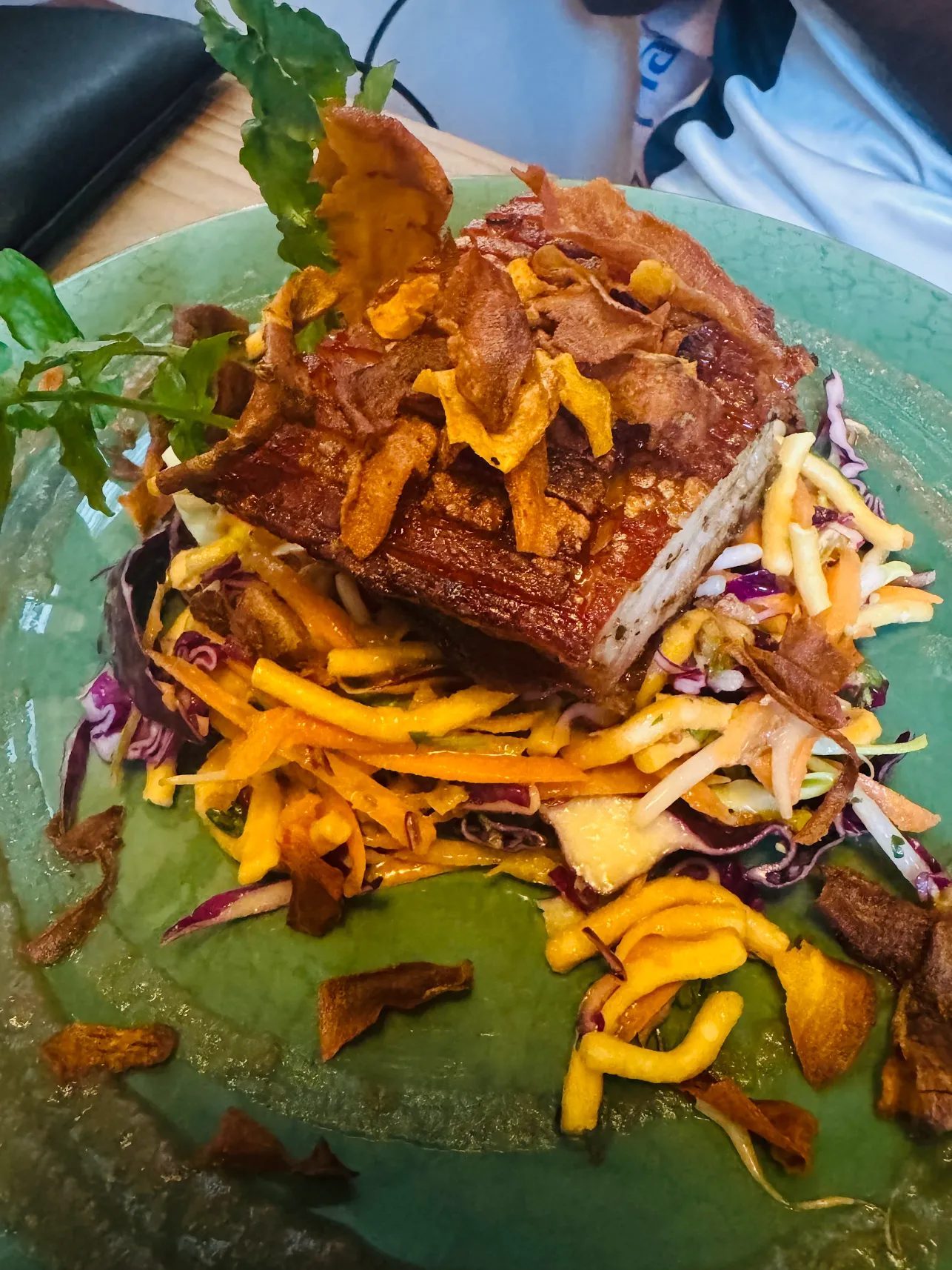 Pork belly with crackling over bang bang slaw