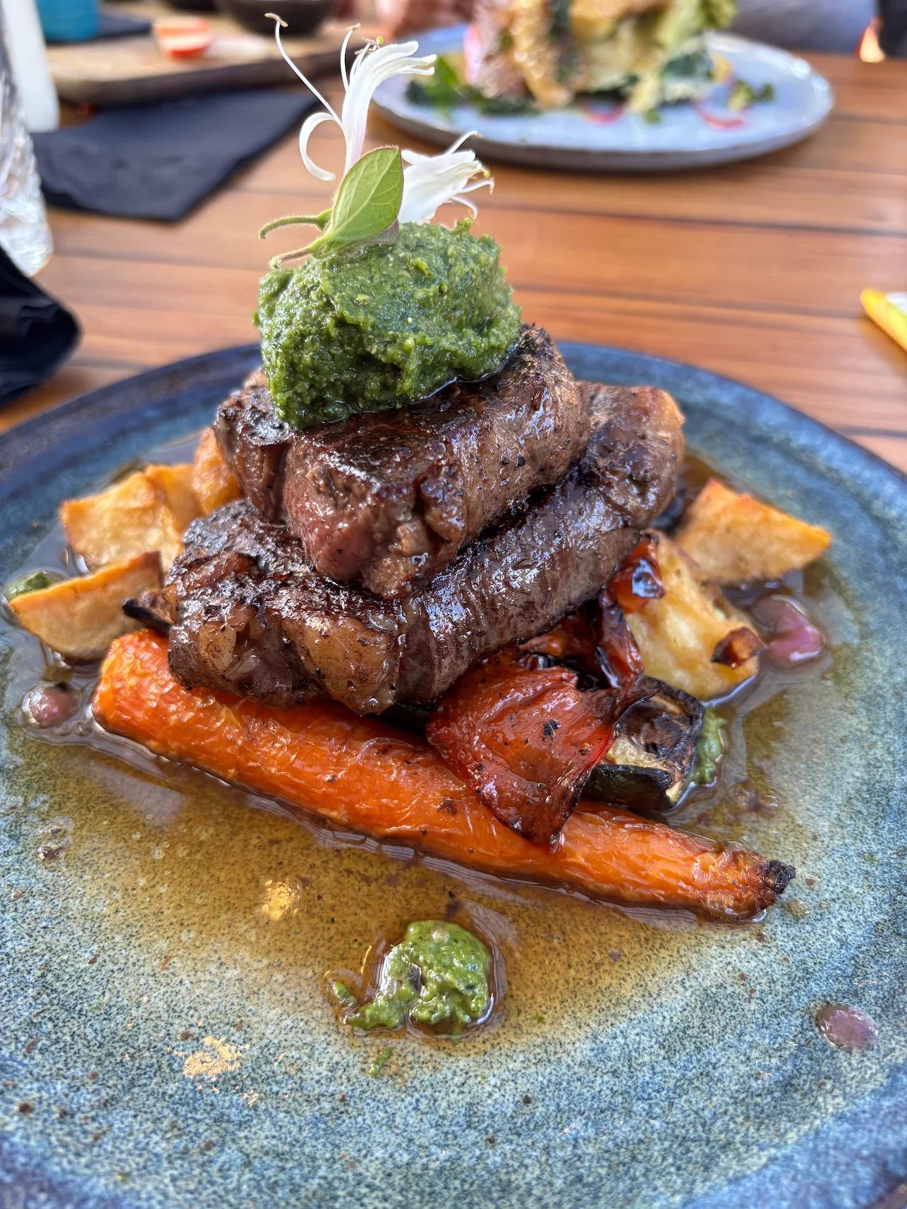 Aged reserve ribeye with chimichurri and roast vegetables