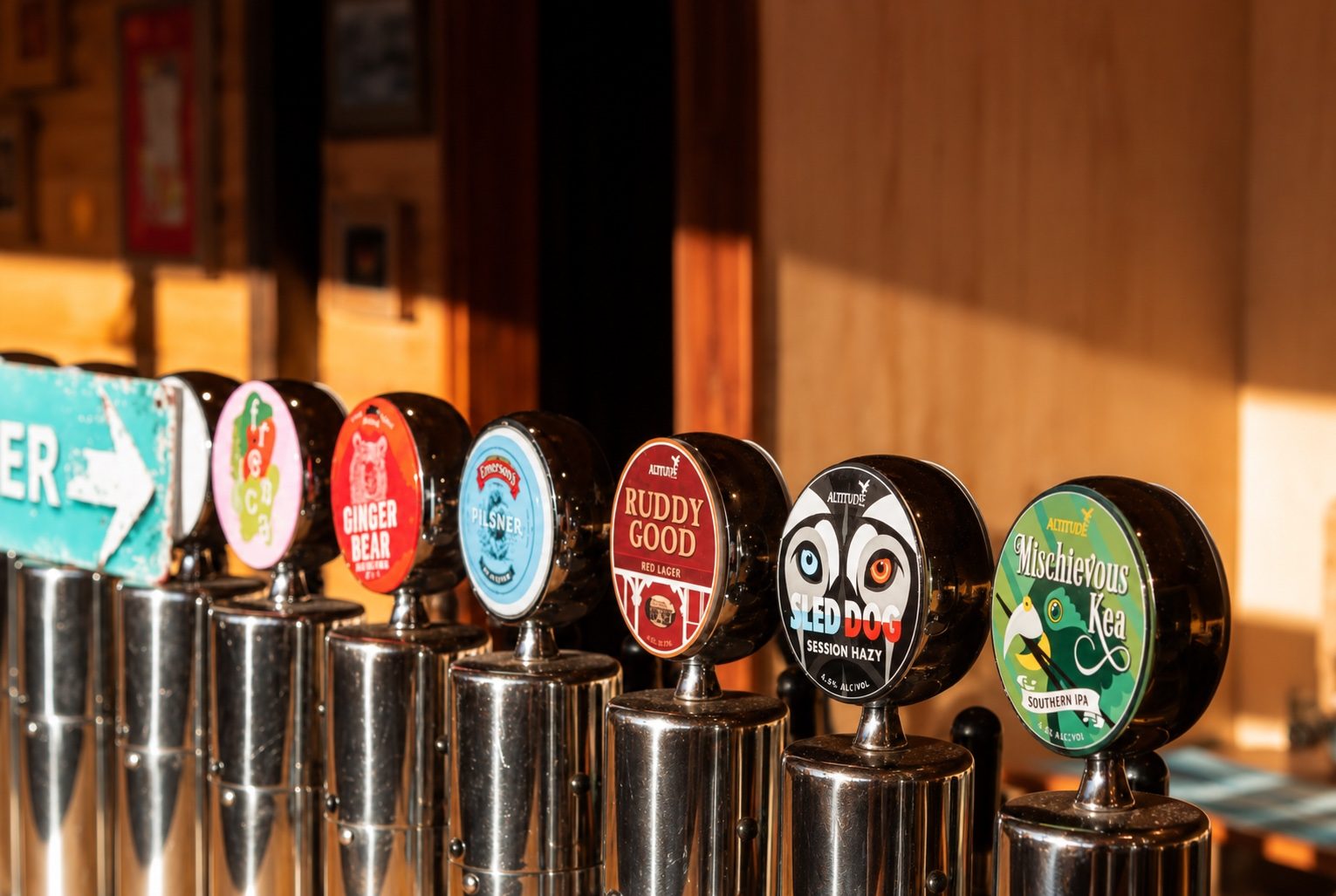 Five beer taps lined up: Ginger Bear, Lover, Ruddy Good, Iced Dog, Mischievous Kea
