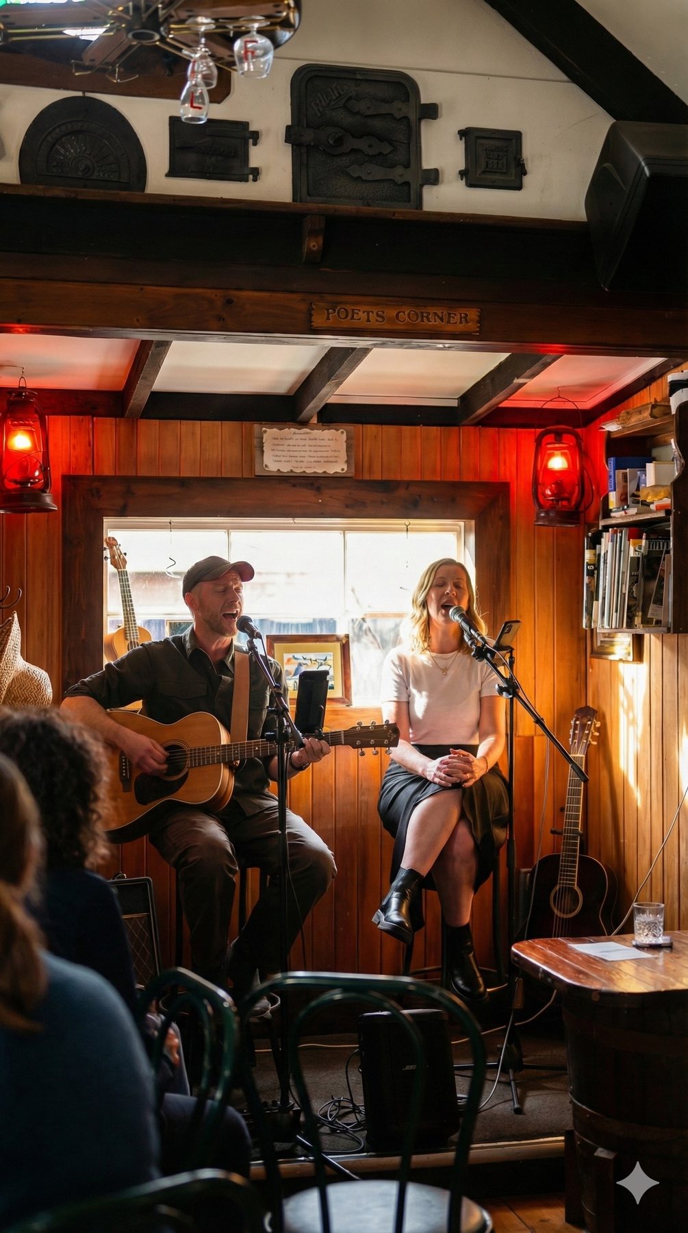 A guitarist and singer playing in the Poets Corner at The Redcliff